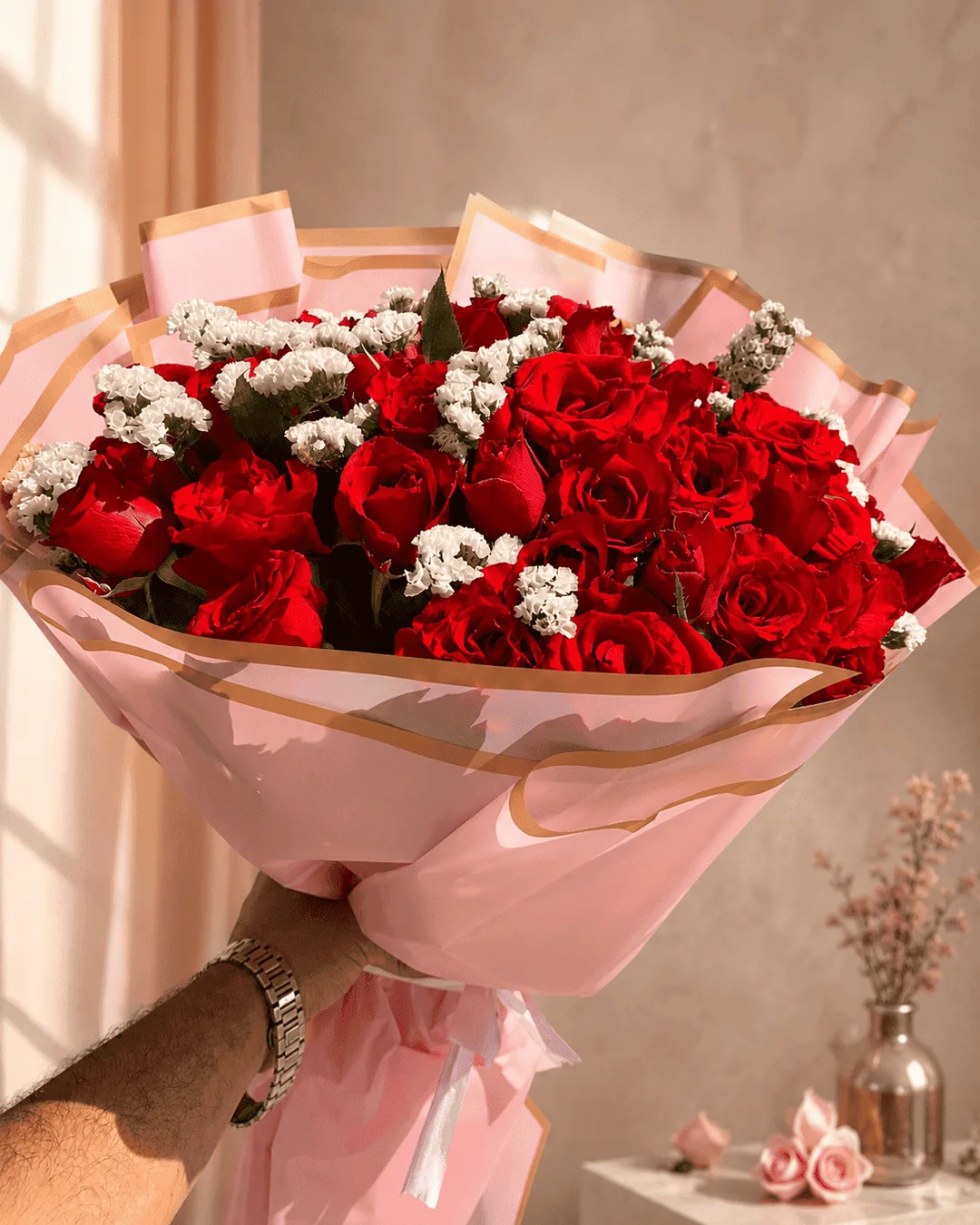 Premium red rose bouquet in pink wrapping for flower delivery in Tangier