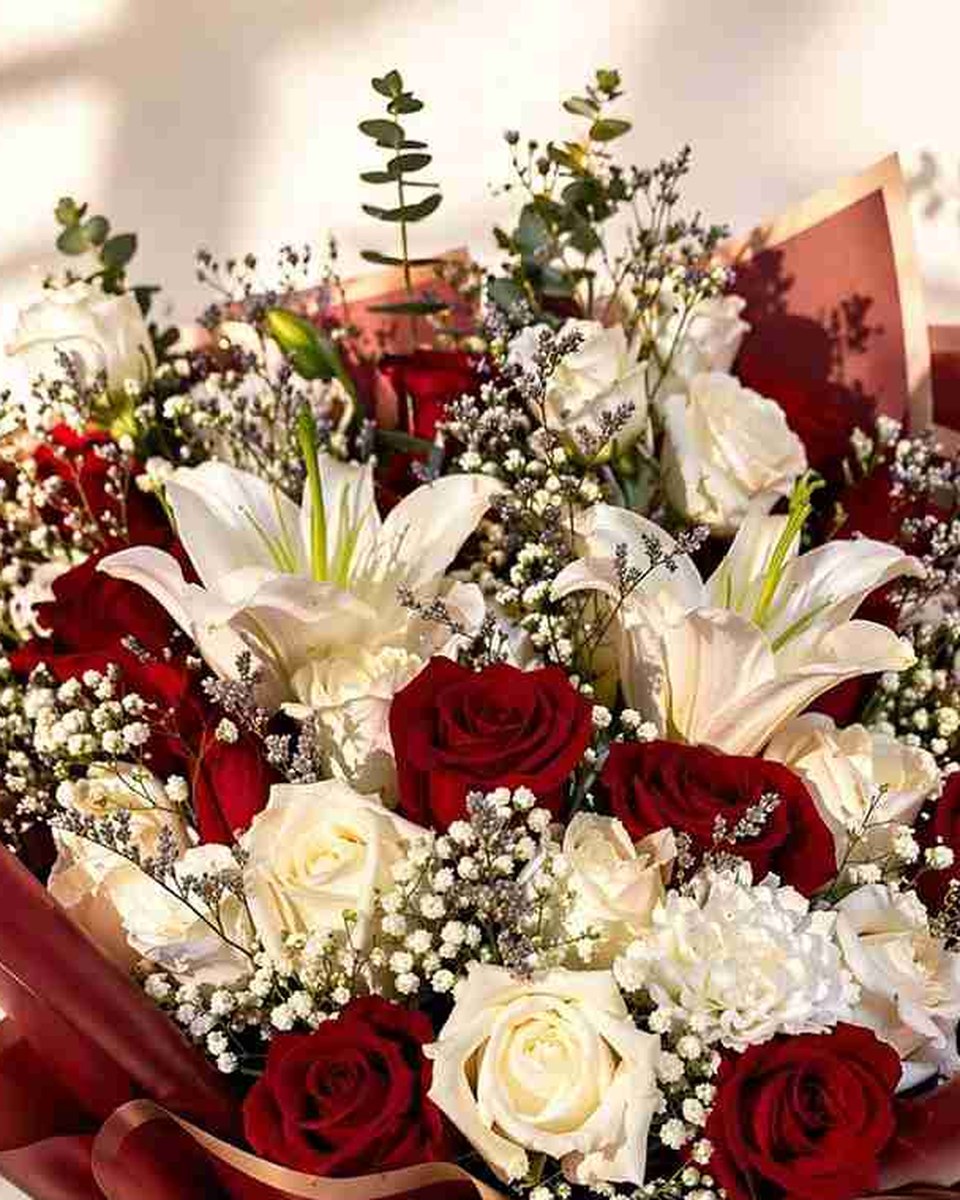 Velarose red roses white roses lilies and baby's breath by Flowers Tangier for same-day flower delivery Tangier and send flowers to Tangier